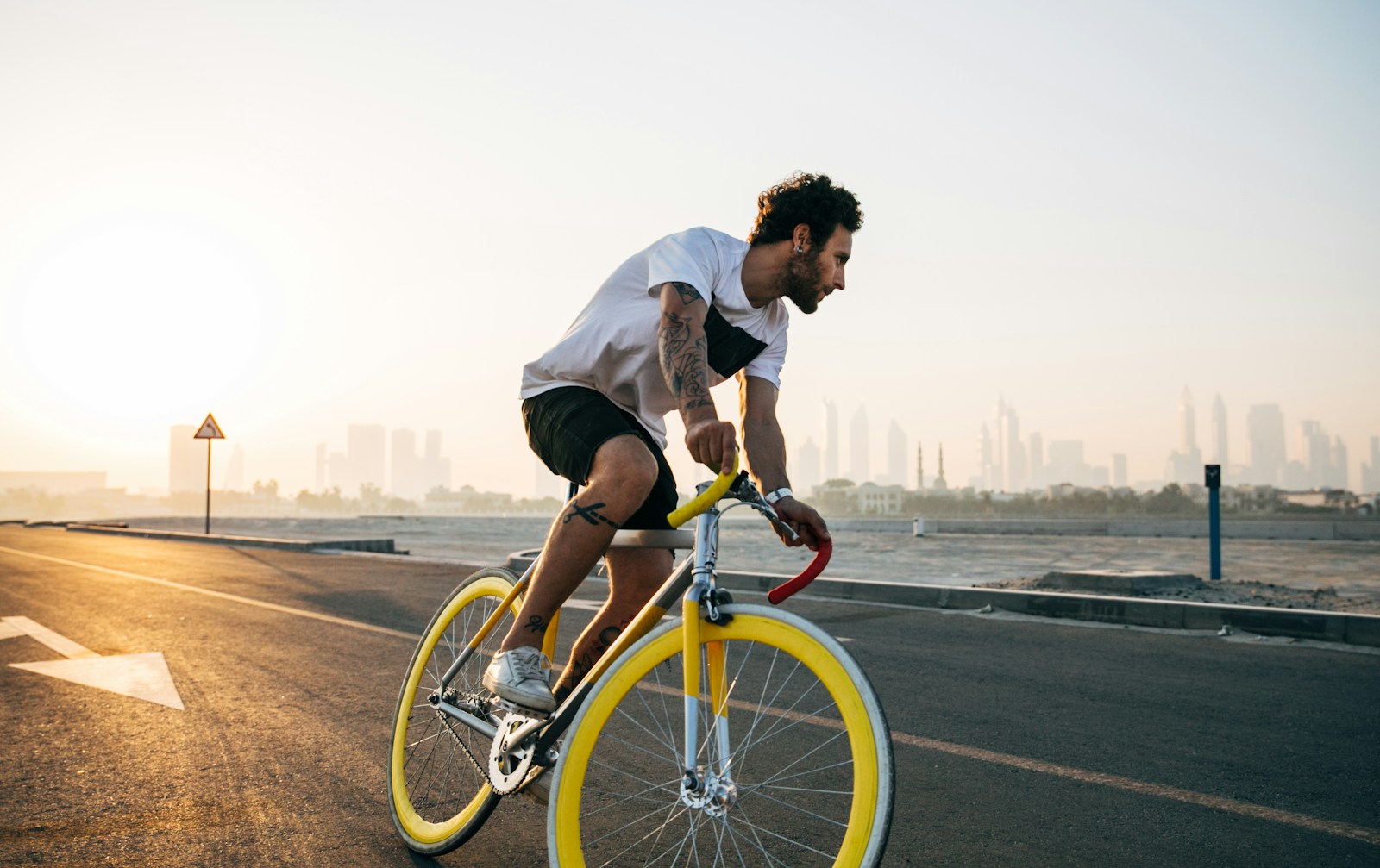 man riding bicycle on road during daytime